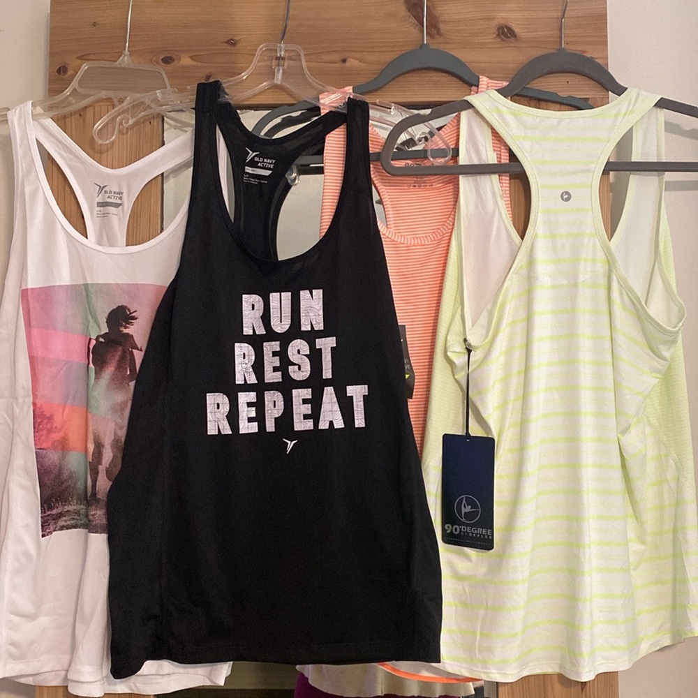 Four workout tanks size L, NWT